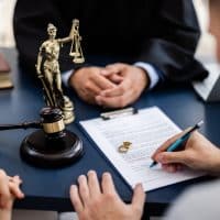 YoungCoupleOneCaucasianAndOneHispanicConsultingWithA