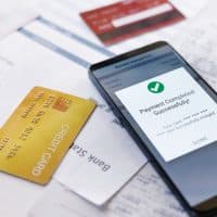 CloseUpShotMobilePhoneShowingScreenSuccessfullyPayingCredit CloseUpShotMobilePhoneShowingScreenSuccessfullyPayingCredit