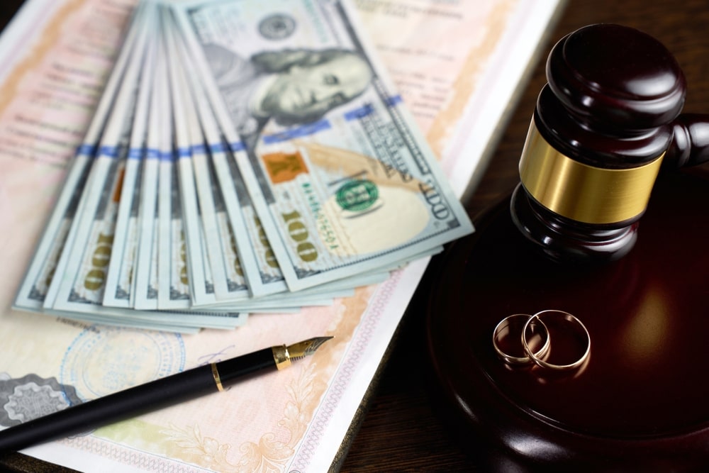 Close-upOfWeddingRingJudgeGavelMoneyDollarBillsMarriage Close-upOfWeddingRingJudgeGavelMoneyDollarBillsMarriage