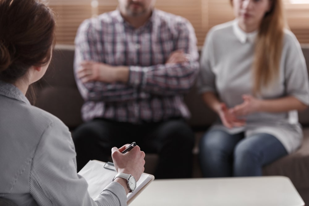 Close-upOfTherapistForCouplesAnalyzingTheBehaviorOfSpouses Close-upOfTherapistForCouplesAnalyzingTheBehaviorOfSpouses