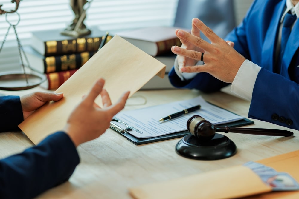 AClientSubmitsLegalDocumentsToAnAttorneyProvidingDetailed