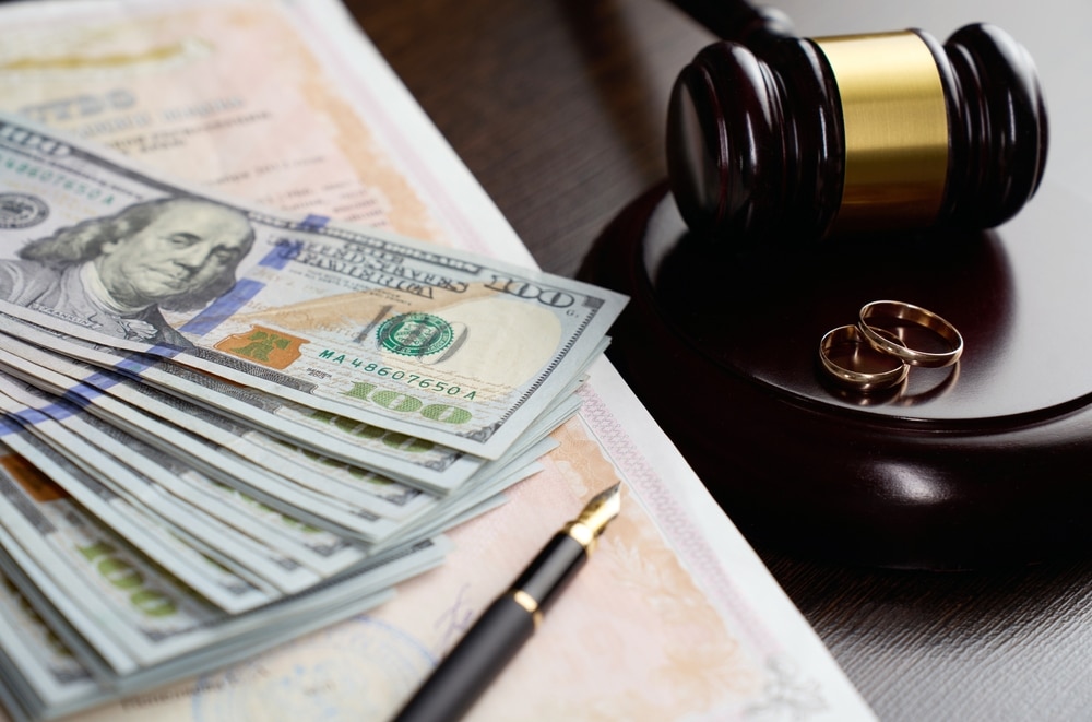 LegalSeparationAndAlimonyConceptWeddingRingsJudgeGavelUs