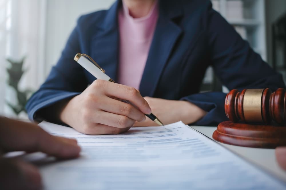 LawyerIsSigningALastWillAndTestamentDuringA LawyerIsSigningALastWillAndTestamentDuringA