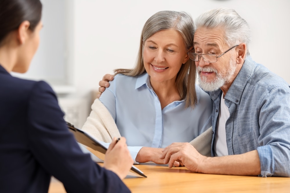 NotaryConsultingSeniorCoupleAboutLastWillAndTestamentIn NotaryConsultingSeniorCoupleAboutLastWillAndTestamentIn