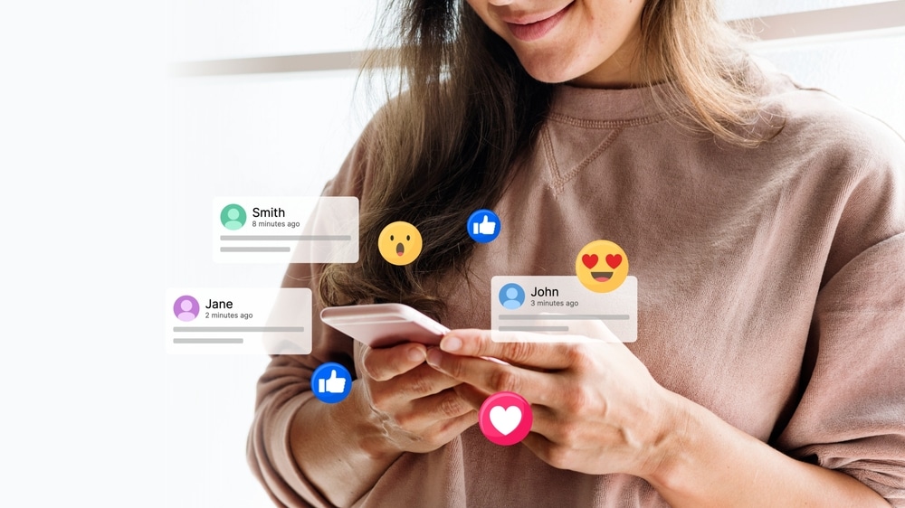 WomanUsingSmartphoneWithSocialMediaIconsNotificationsLikesAnd WomanUsingSmartphoneWithSocialMediaIconsNotificationsLikesAnd
