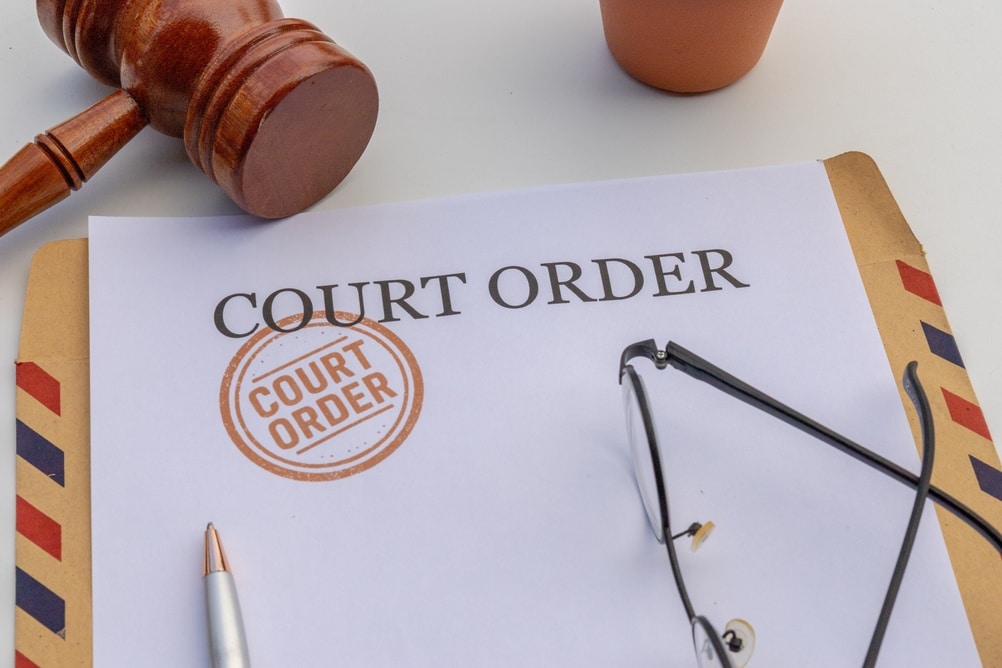 CourtOrderDocumentWithRedStampMarkJudgeGavelAnd CourtOrderDocumentWithRedStampMarkJudgeGavelAnd