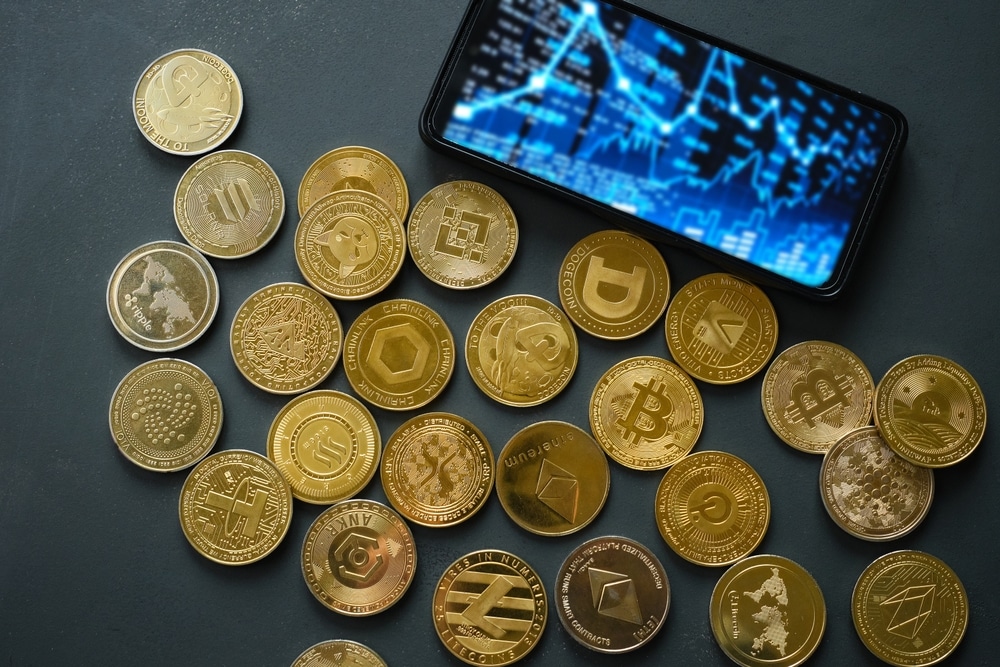 VariousCryptocurrencyCoinsLayScatteredOnADarkTableA VariousCryptocurrencyCoinsLayScatteredOnADarkTableA