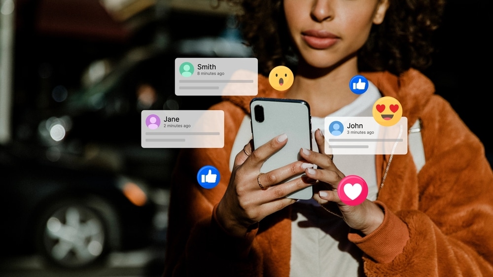 PersonUsingSmartphoneWithSocialMediaIconsFloatingAroundEngaging PersonUsingSmartphoneWithSocialMediaIconsFloatingAroundEngaging